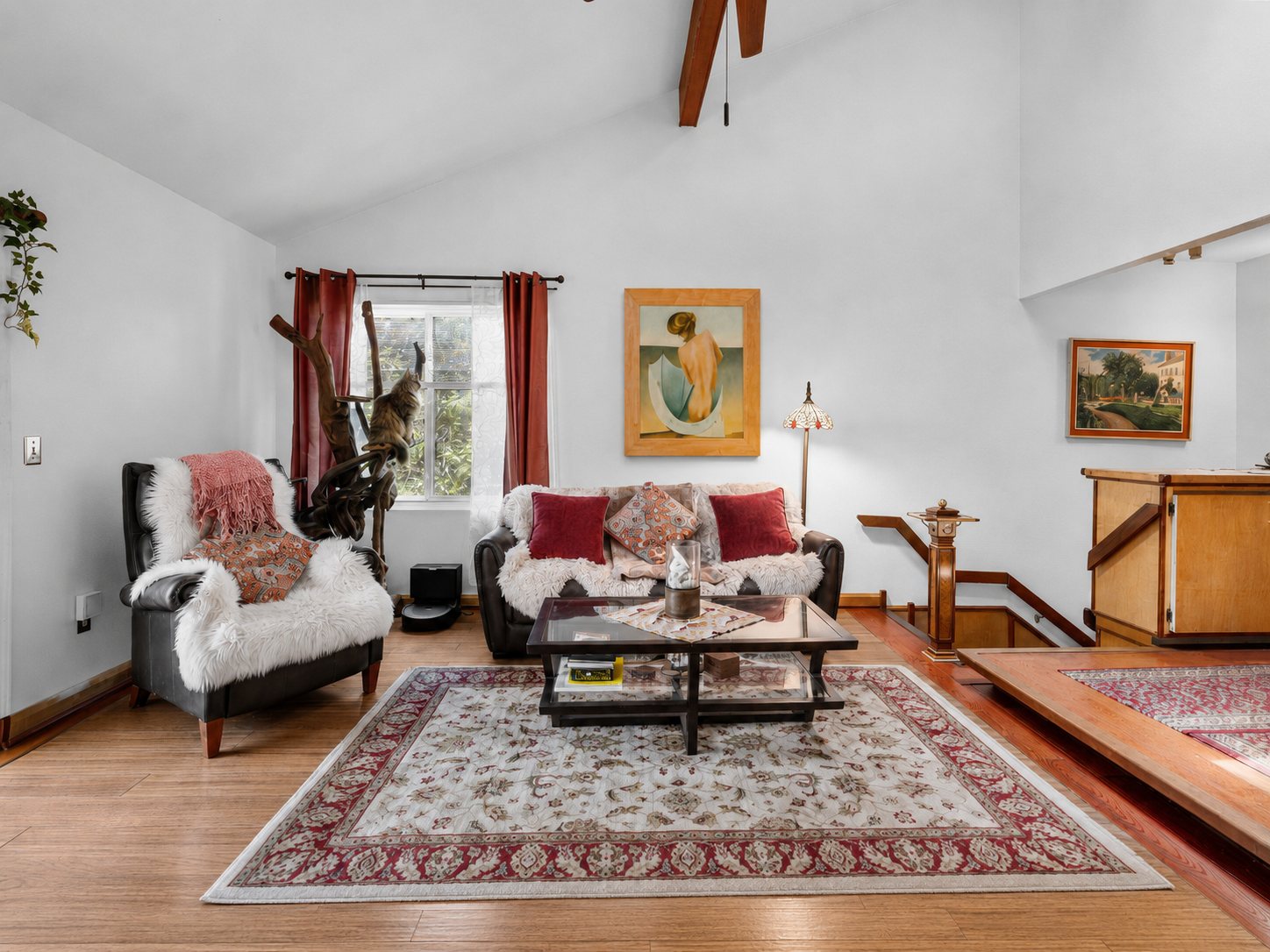Living room with vaulted ceiling and warm wood details